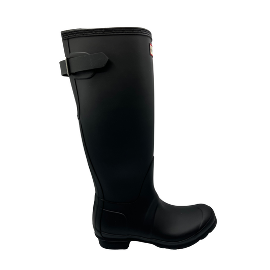 Right facing view of black waterproof tall boot with adjustable calf strap and low heel.