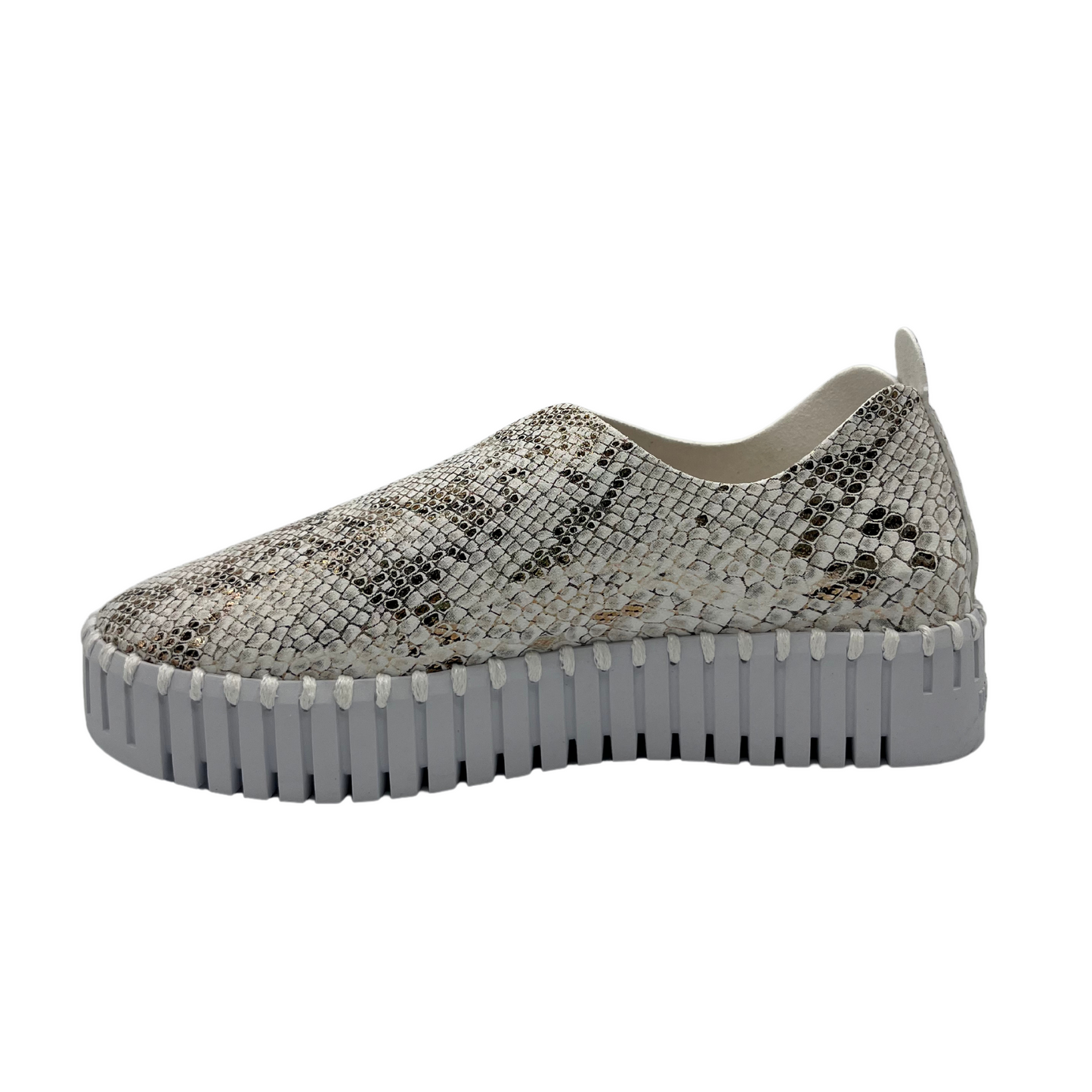 Left facing view of leather snake print sneaker with platform white rubber outsole