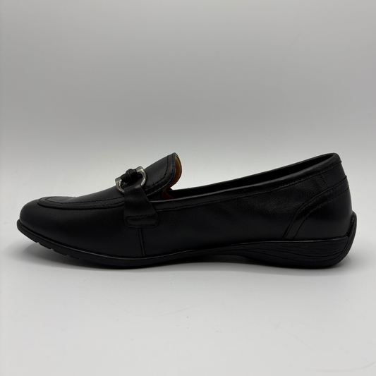 Black loafer shoe on a gray background