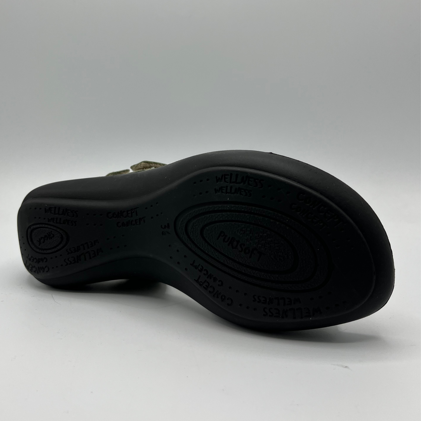 Bottom view of a green nubuck leather sandal with 4 adjustable hook and loop straps, a contoured footbed and a black outsole.