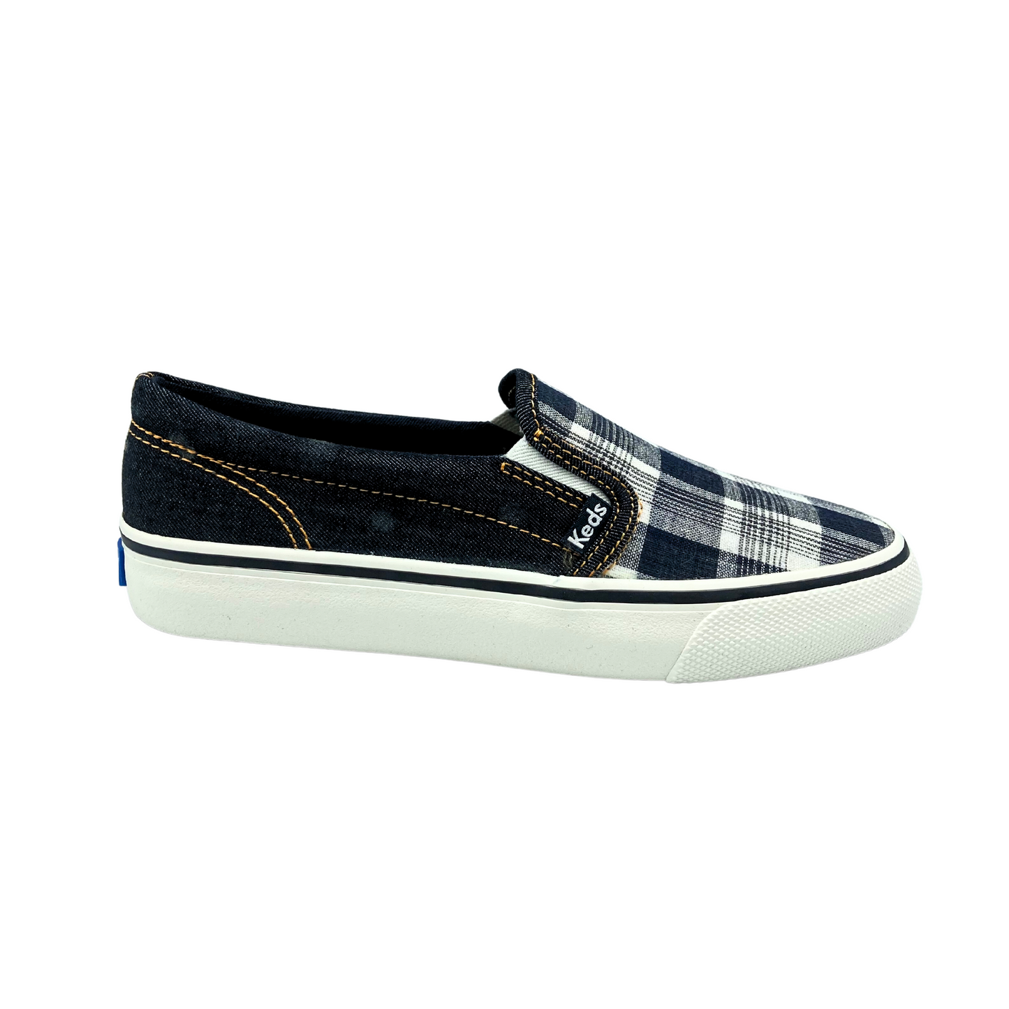 Outside view of a canvas slip on sneaker in a black plaid colorway. Black plaid on top of foot. Sides and back are in the black denim. Outsole is white rubber with a black stripe around the top