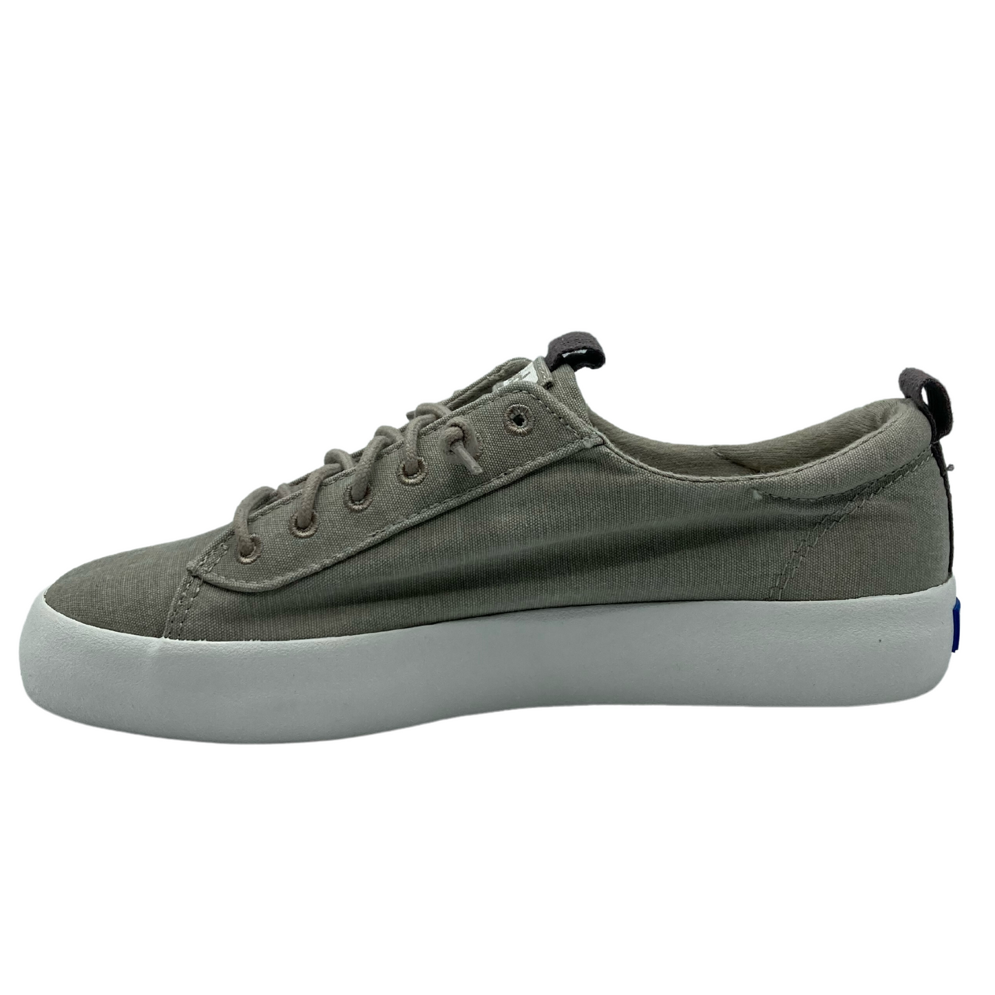 Side view of the inside of the right shoe with dark grey pull on tabs on the tongue and heel of shoe