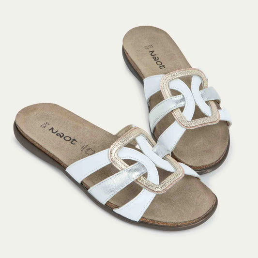 Pair of sandals with white straps on a light gray background