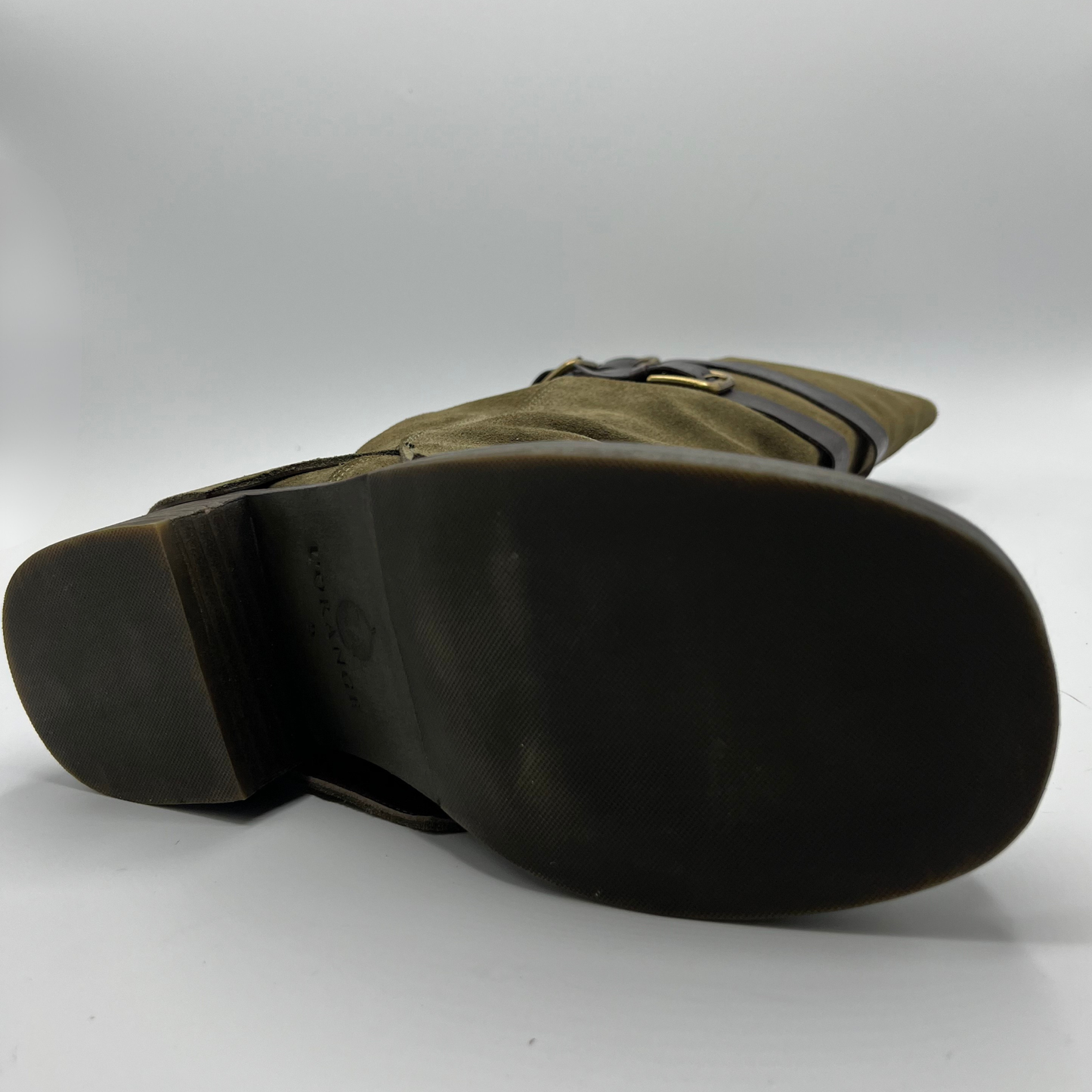 Green leather boot sole on a white background