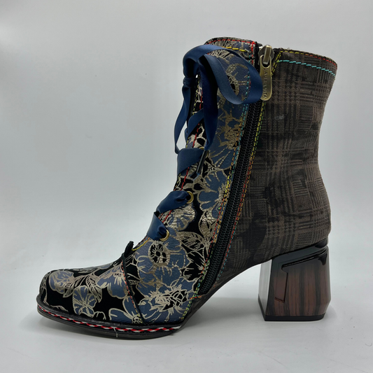 Boots with floral pattern on the side and textured brown design on the top, on a white background
