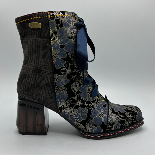Ankle boot with floral pattern and wooden heel on a white background
