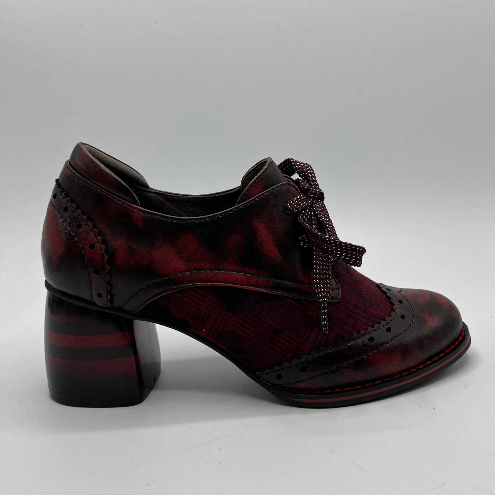 Red mix shoe with a block heel on a white background