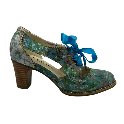 Right facing view of patterned leather oxford with blue ribbon laces and stacked heel.