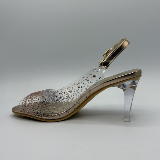 Clear high-heeled shoe with rose gold accents on a gray background