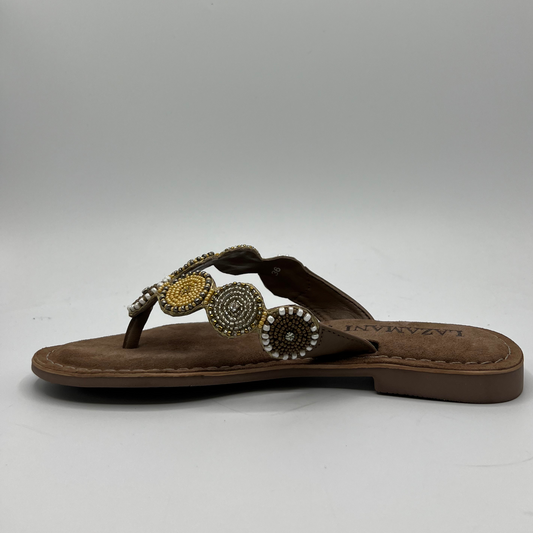 Left facing view of a beaded strapped, thong sandal with a suede wrapped footbed and lightweight rubber outsole.
