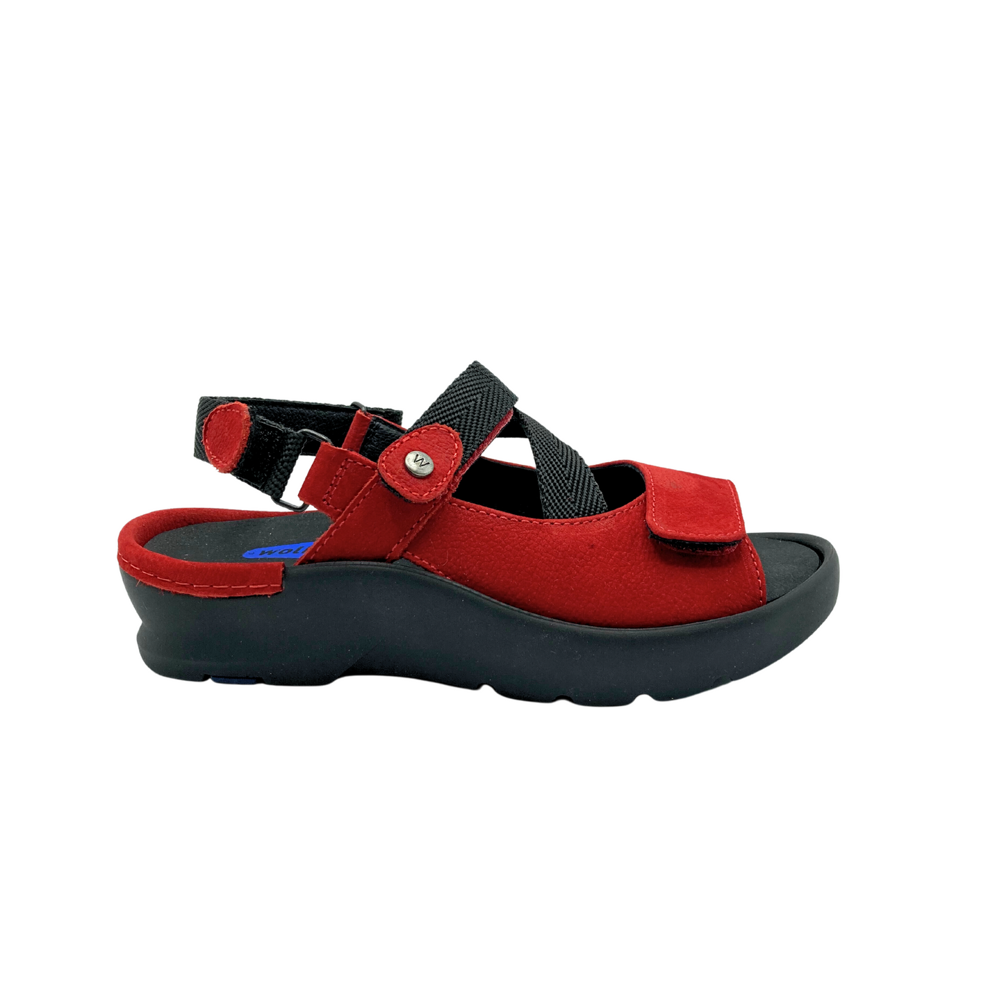 Outside view of a red leather sandal. Ergonomic footbed is removable.