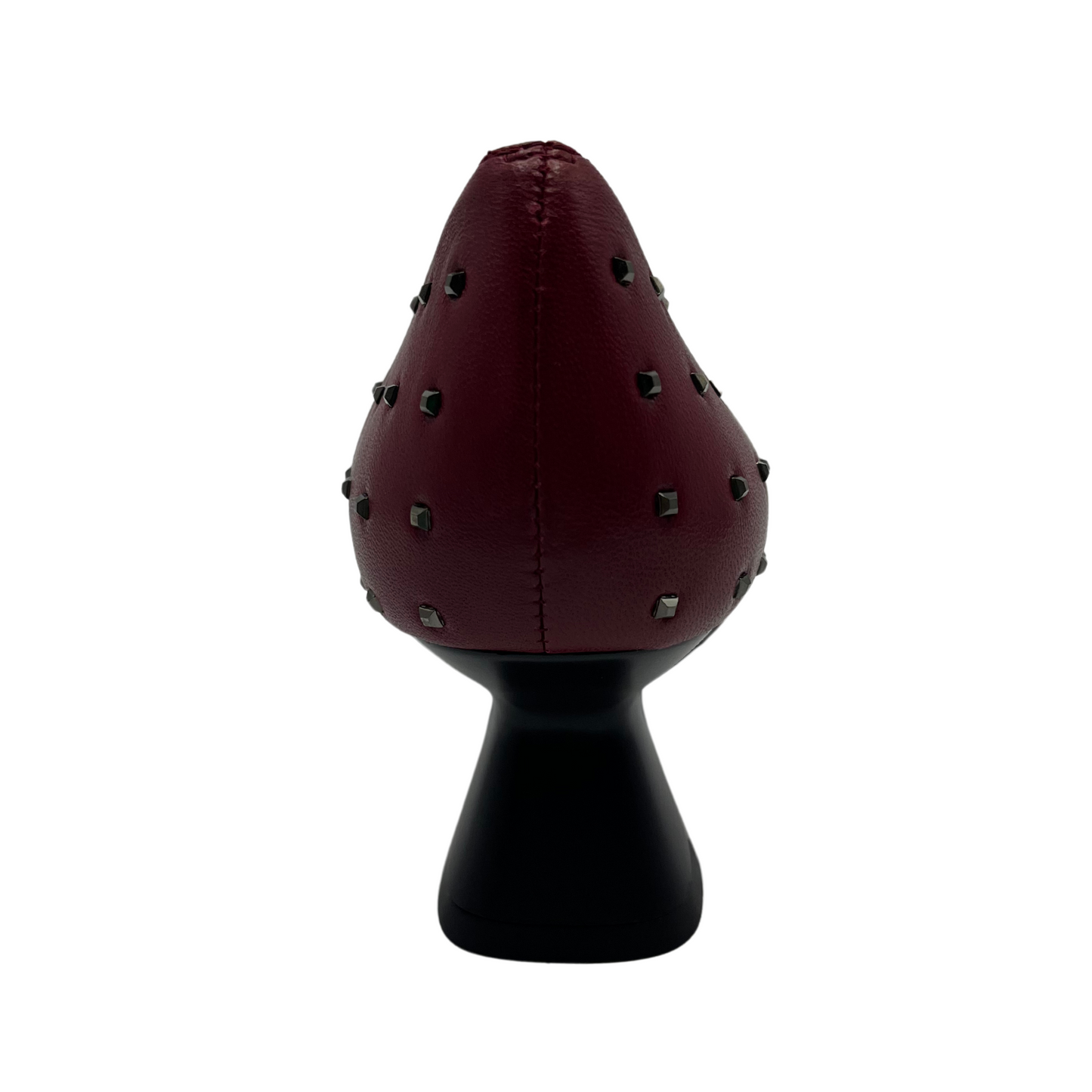 Back view of red leather pump with metallic studs and flared heel