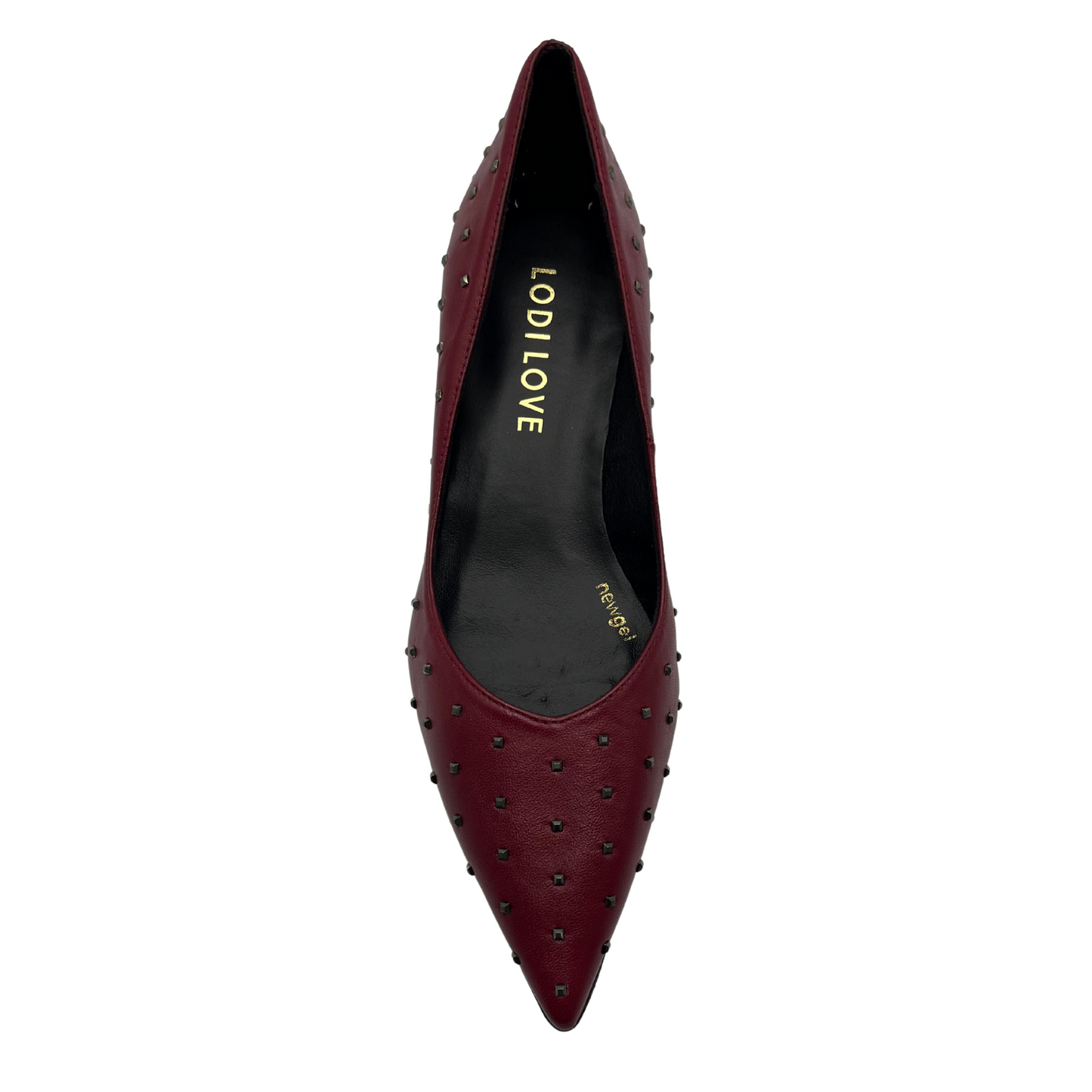 Top view of red leather pump with metallic studs and flared heel
