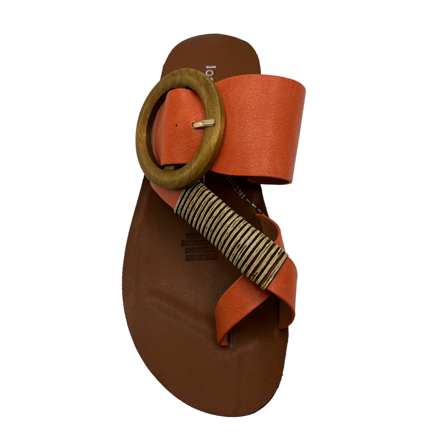 Top view of orange strapped slip on sandal. Featuring a wooden buckle and bamboo wrap on the toe strap.