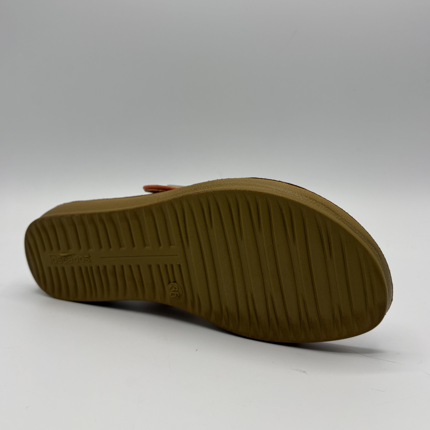 Bottom view of a tangerine coloured sandal with two straps