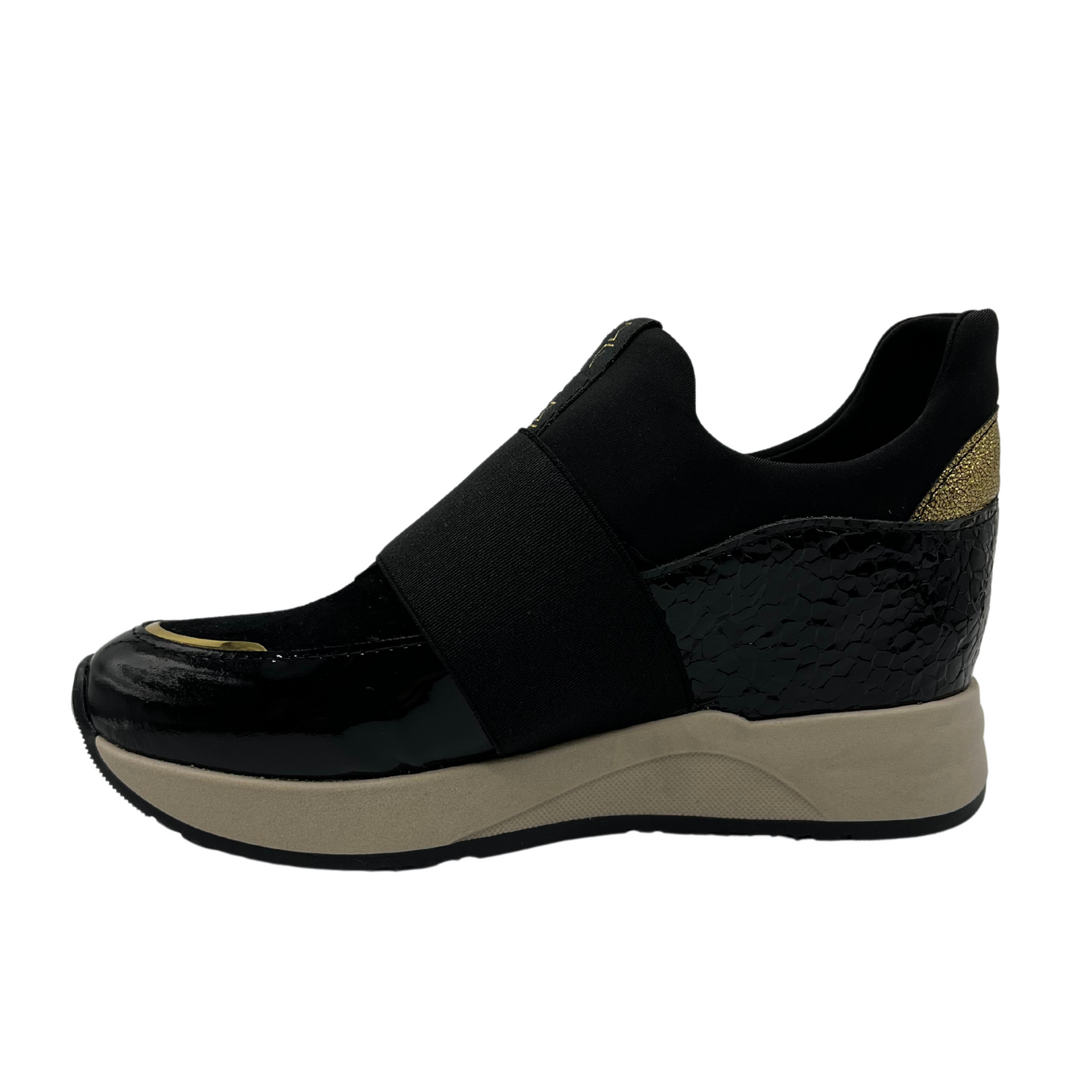 Left facing view of black hidden wedge sneakers with an elastic closure and beige outsole