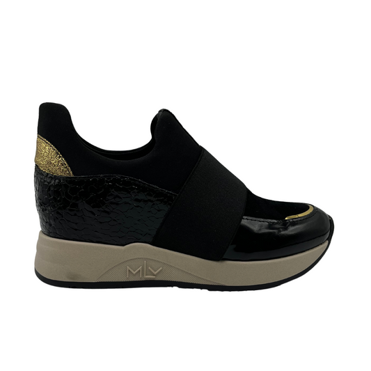 Right facing view of black hidden wedge sneakers with an elastic closure and beige outsole