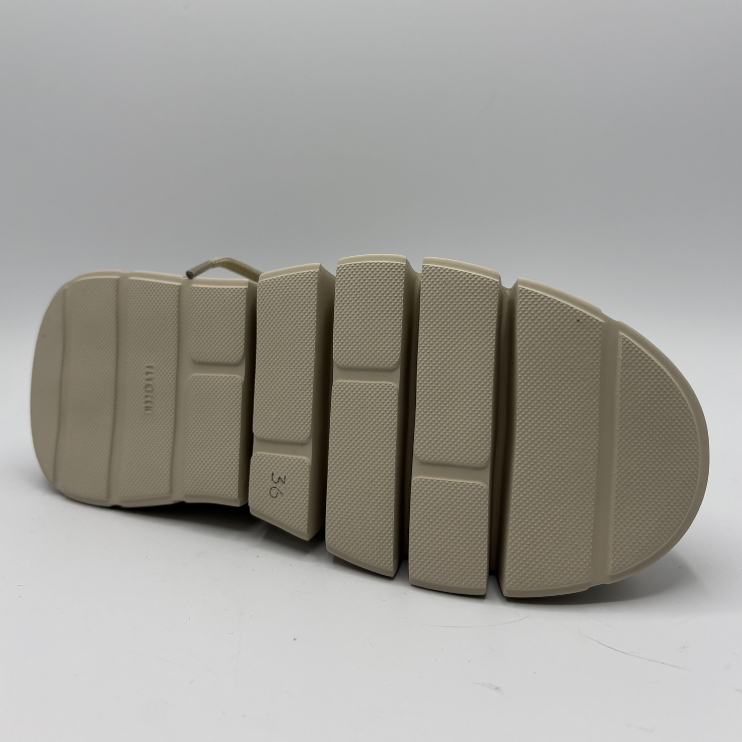 Beige sole of a shoe on a white background