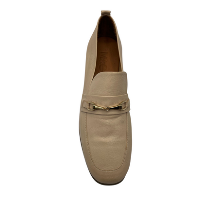 Top view of nude leather loafers with gold bit detail, leather lining and short heel