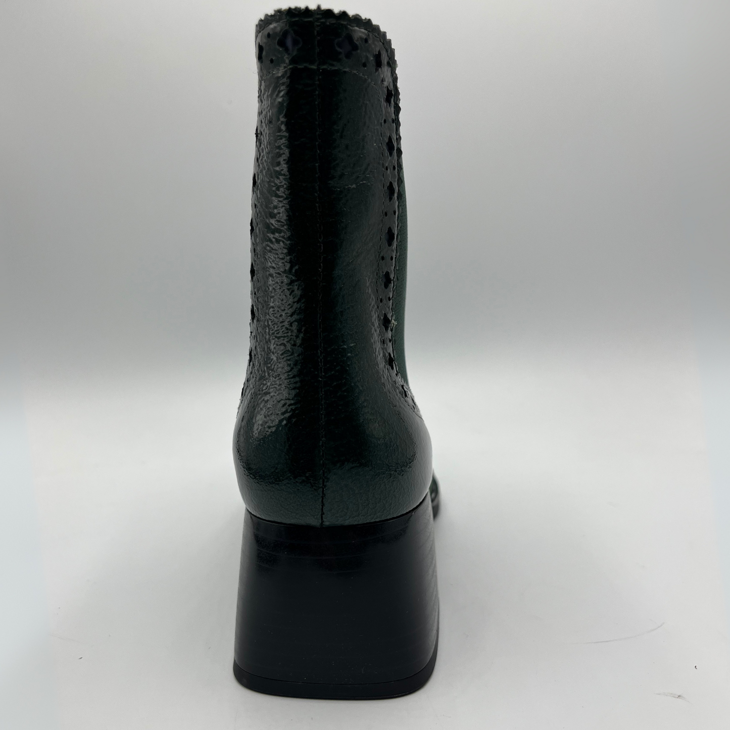 Black high-heeled shoe on a white background
