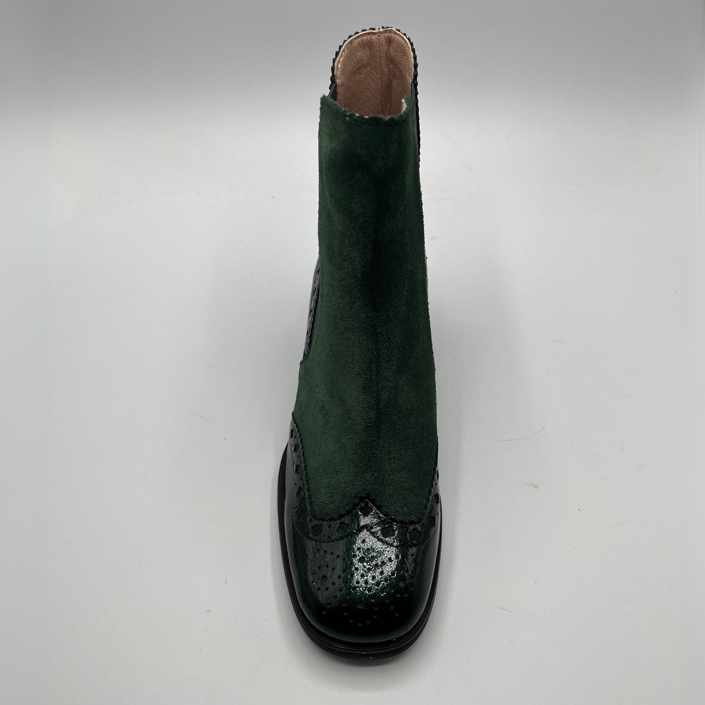 Green and black shoe on a gray background