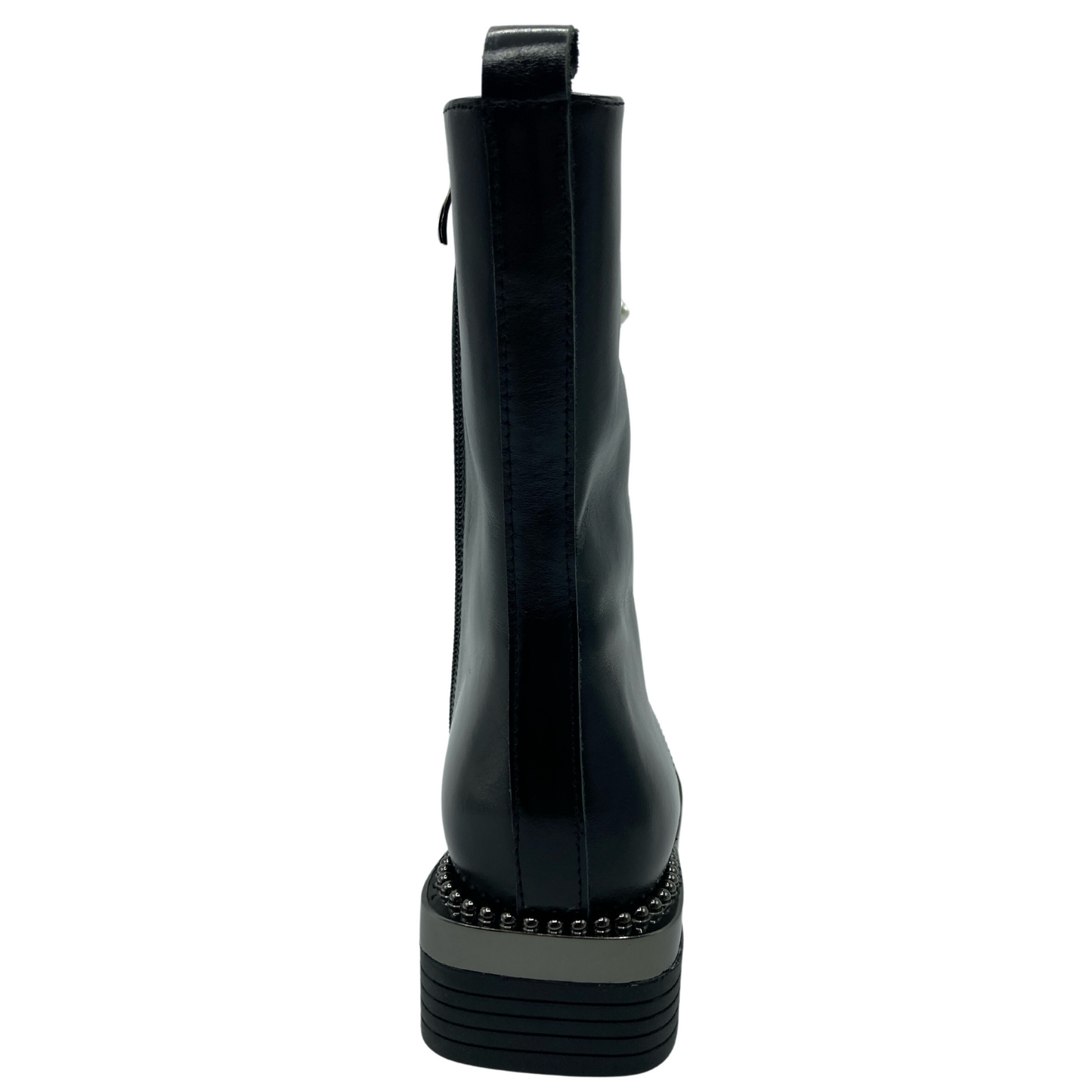 Back view of black leather boot with block heel with studs along base