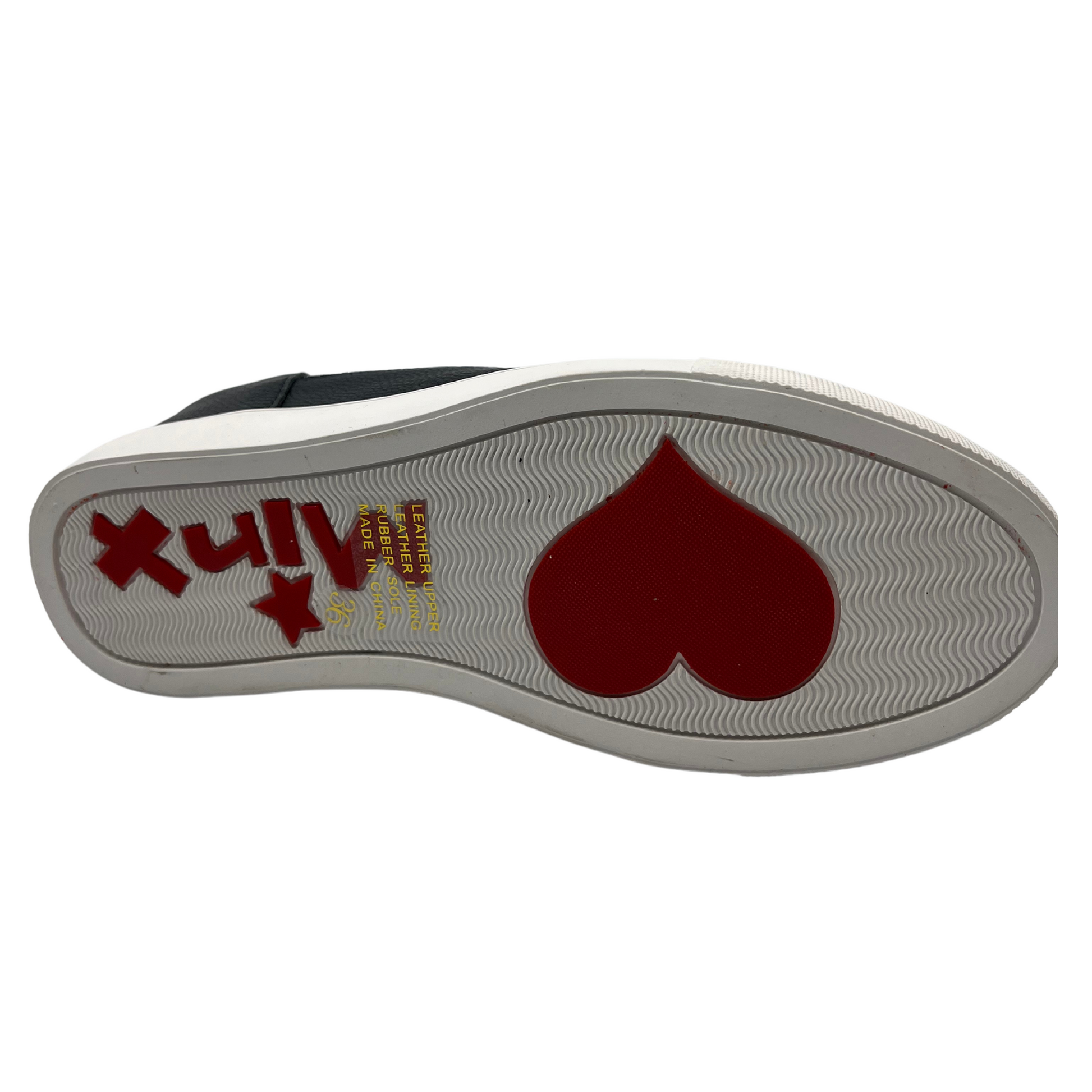 Bottom view of leather wedge sneaker with hidden wedge, cut out and embroidered upper and white rubber outsole.