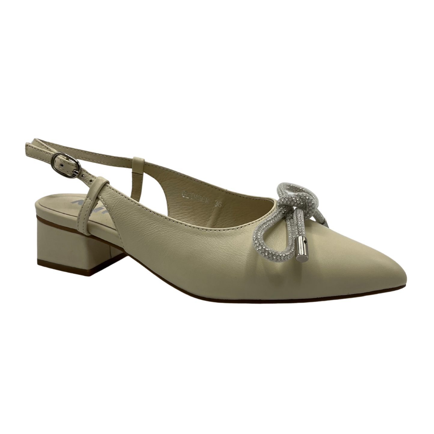 45 degree angled view of an ivory leather slingback pump with a rhinestone bow detail on upper and pointed toe.