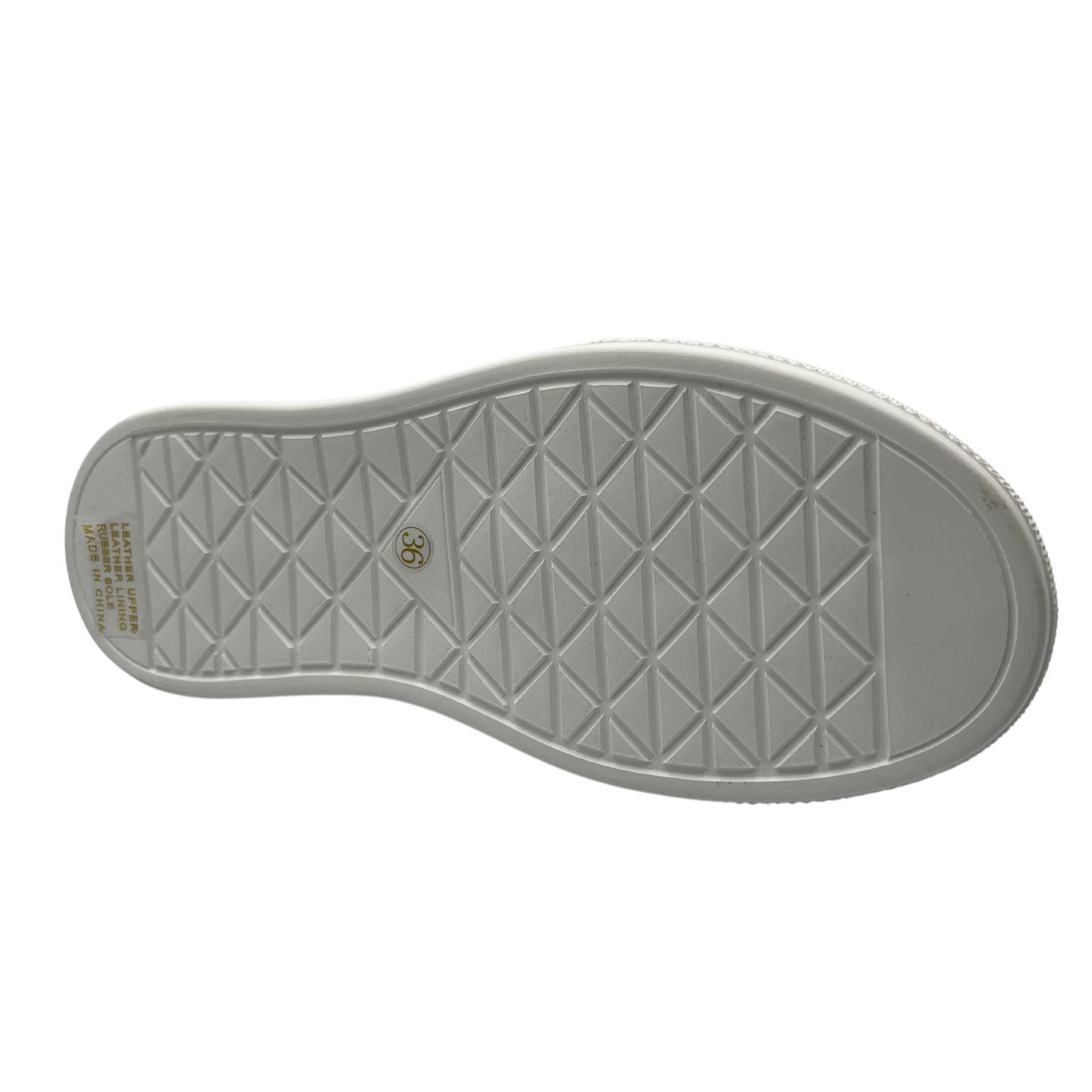 Bottom view of a black leather boat shoe with white rubber platform outsole and white laces