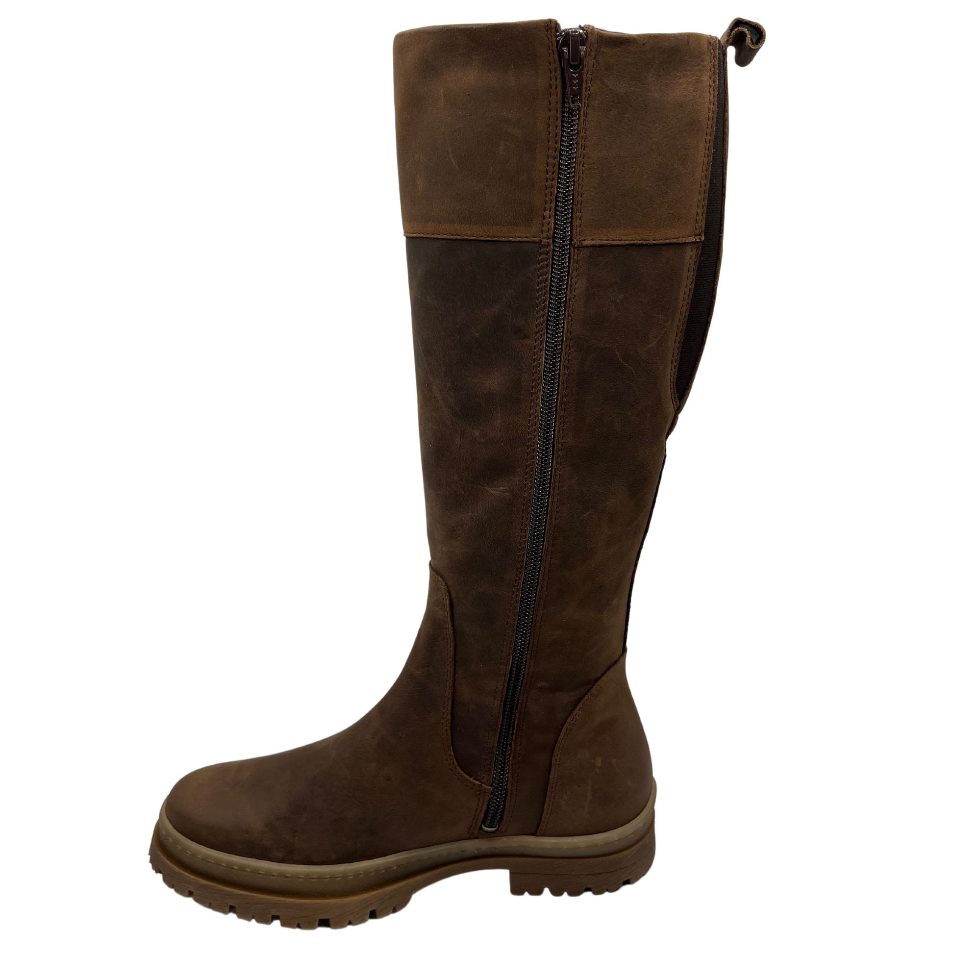 Left facing view of brown leather knee height boot with rubber lug outsole, inside zipper and pull on tab
