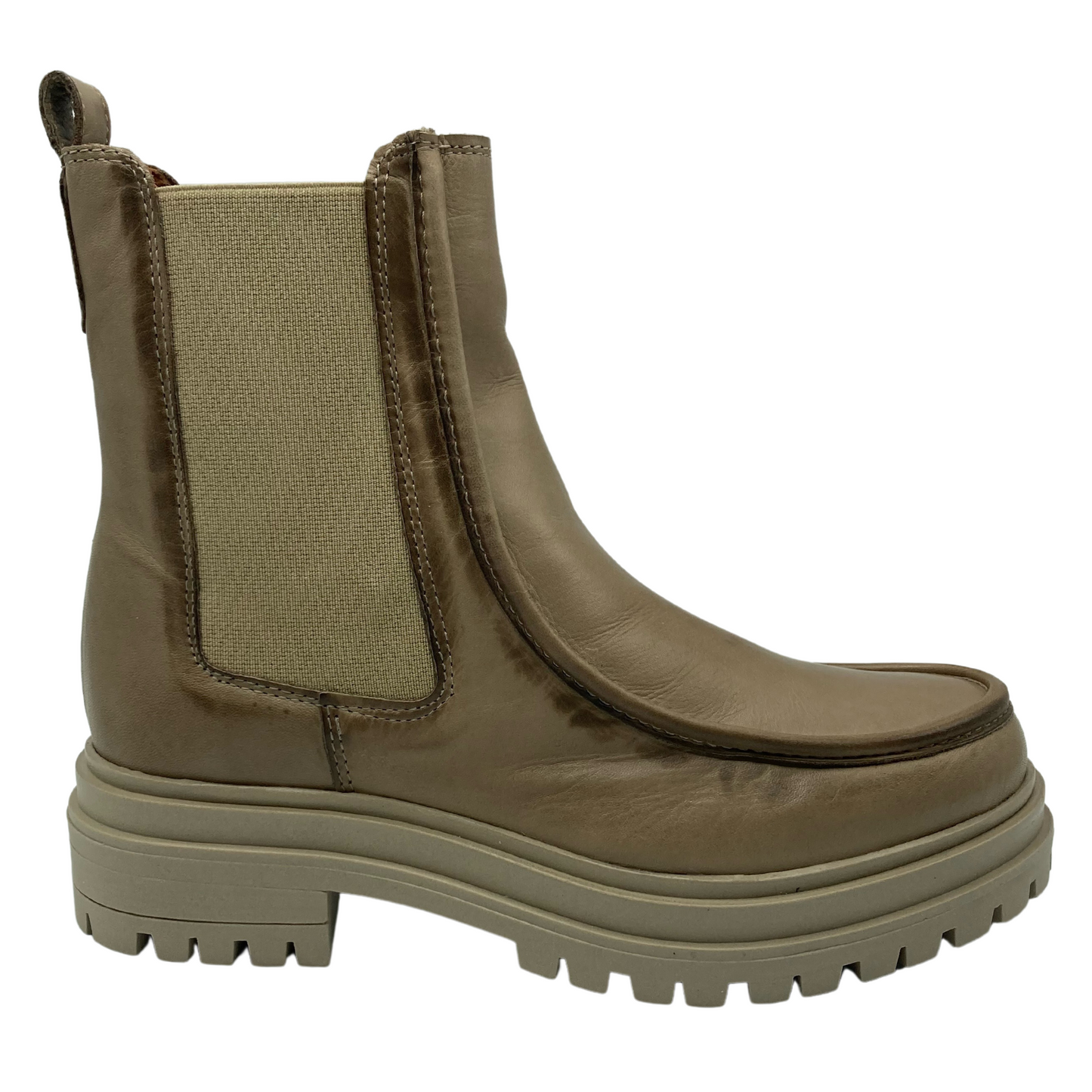 Right facing view of leather short boot with lug sole, elastic gore and pull on tab