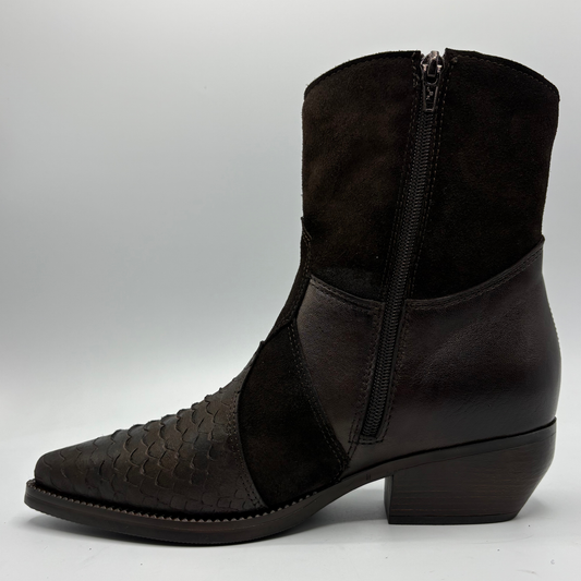 A dark brown ankle boot with a mix of textured python-patterned leather, smooth leather panels, and a dark brown suede-like shaft, featuring a side zipper.