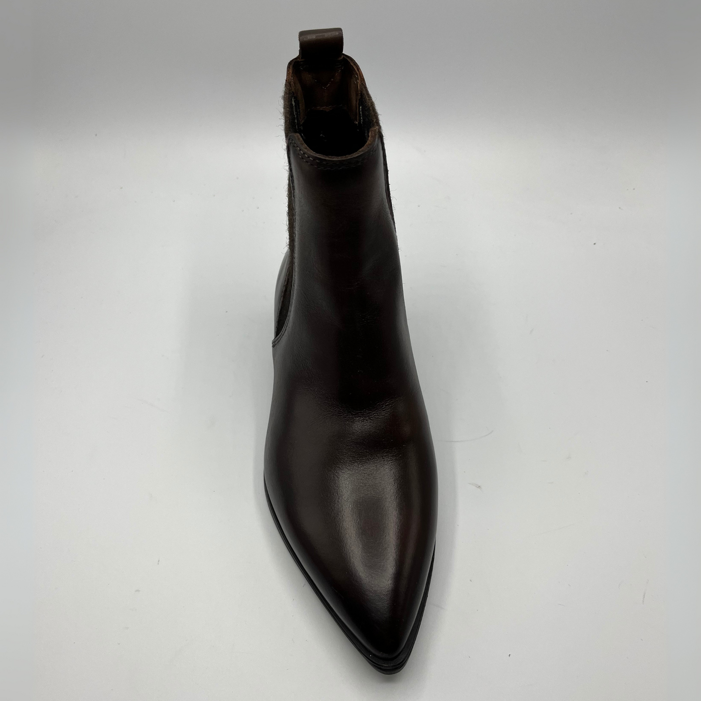 Black leather boot on a white background