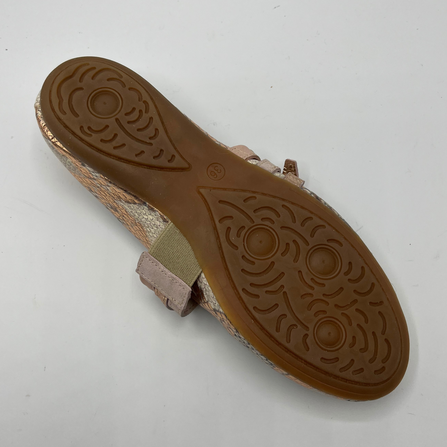 Bottom view of a metallic pink and snake print ballet flat with a leather upper and lining.