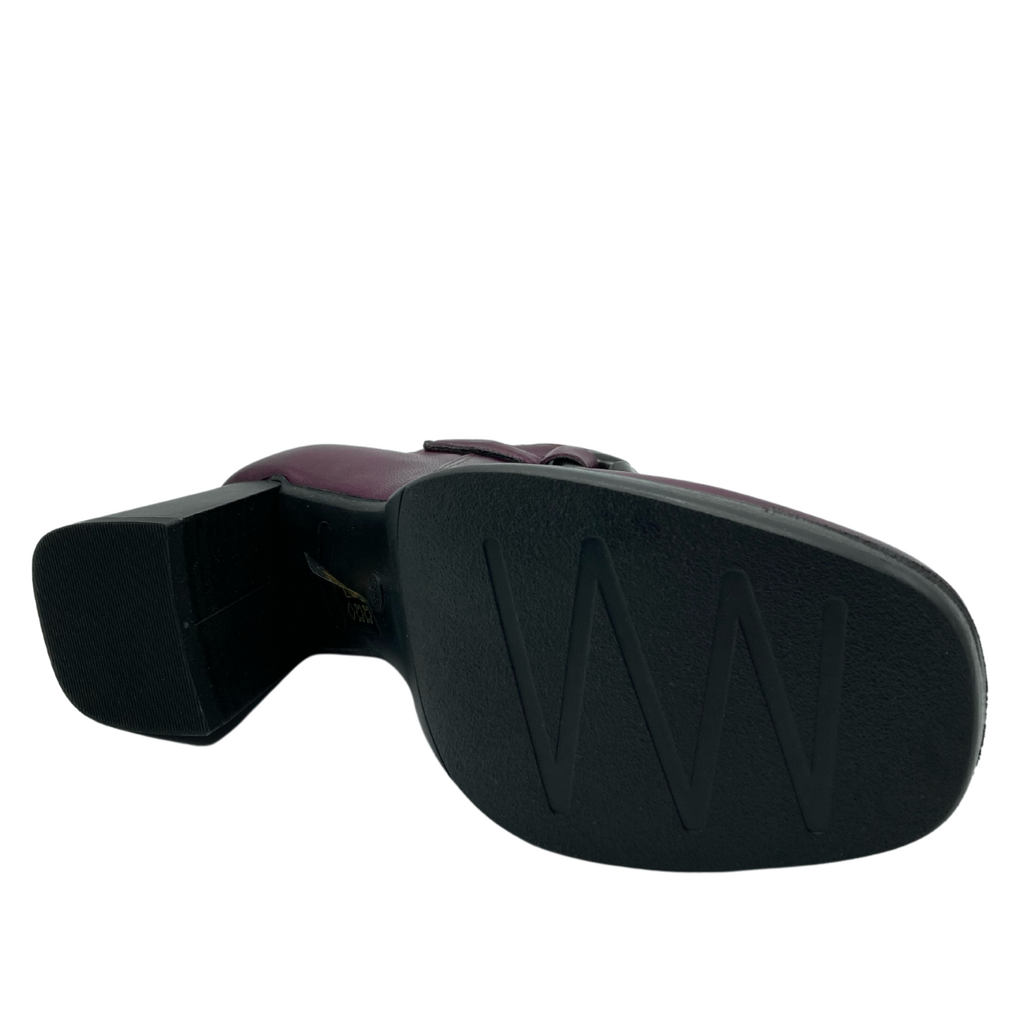 Bottom view of black sole of boot with chunky heel