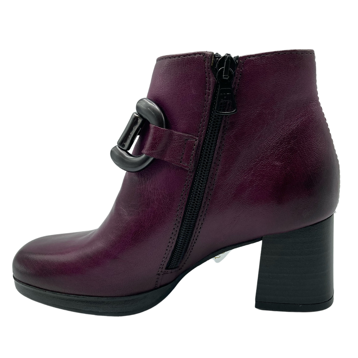Left facing view of short boot with black heel, black zipper closure and gunmetal grey bit detail