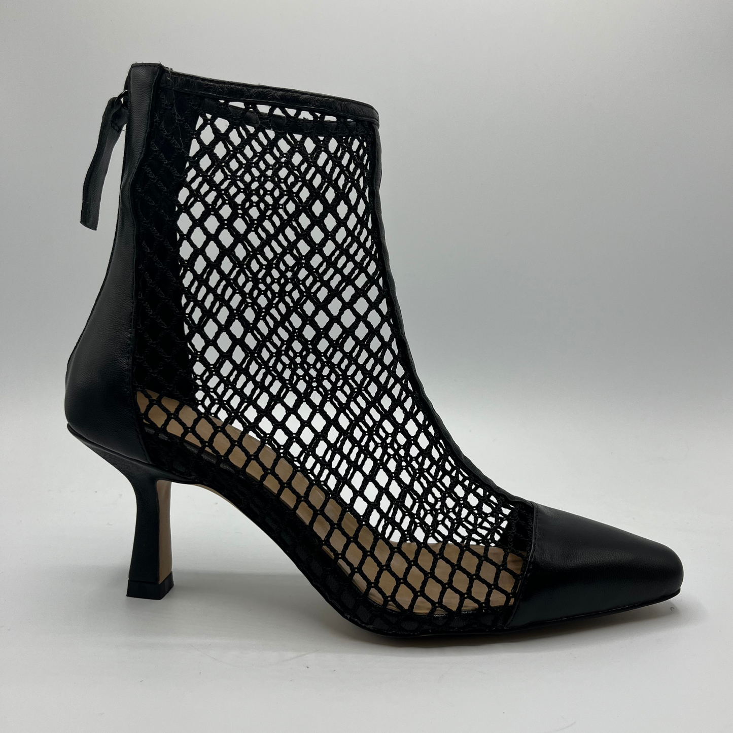 Right facing view of a black mesh heeled boot