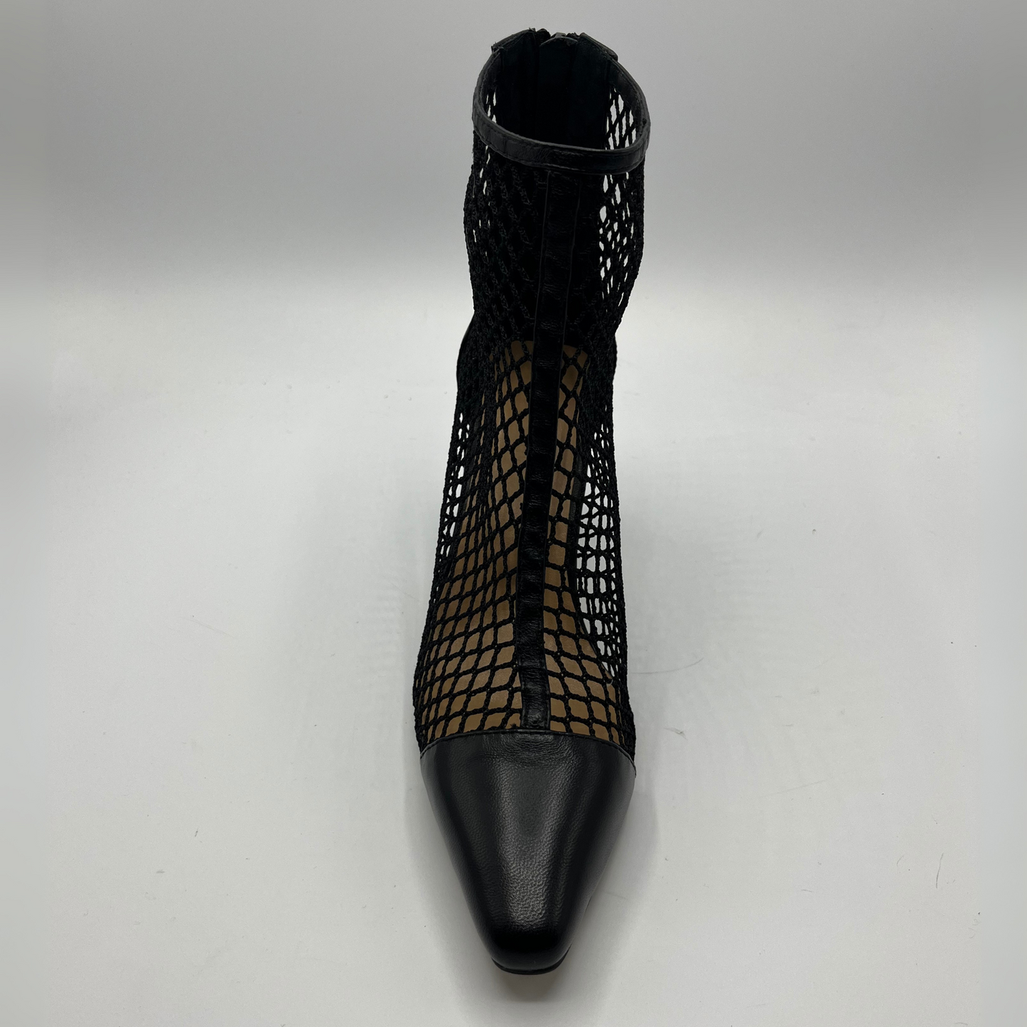 Top view of a black mesh heeled boot