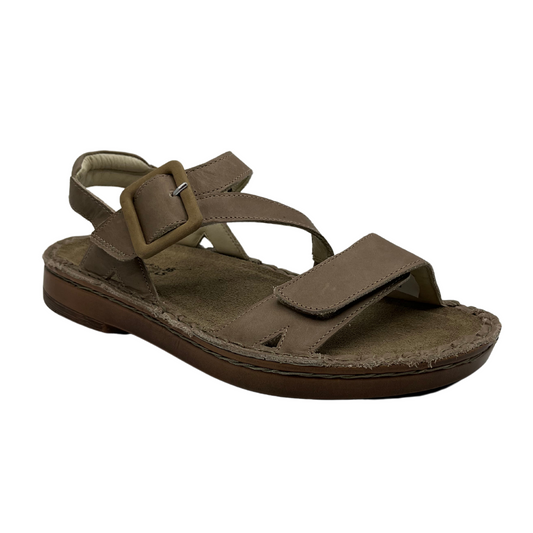45 degree angled view of khaki leather sandal with velcro toe strap, padded collar and suede lined footbed
