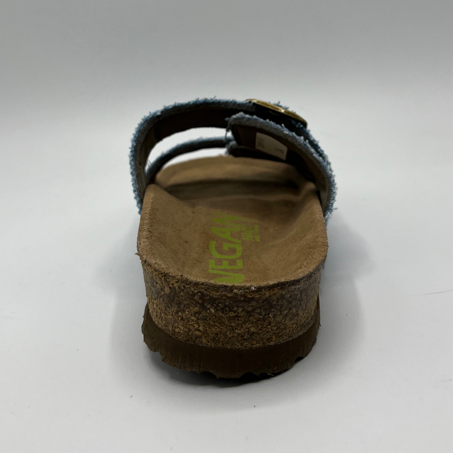 Back view of a denim slip on sandal with a contoured cork footbed and two adjustable straps.