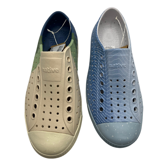 Top view of algae EVA perforated shoes side by side. Both have a rounded toe. 