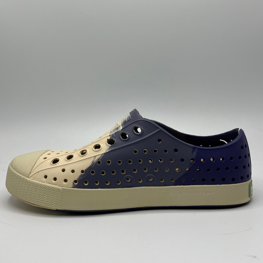 Left facing view of an algae foam slip on shoe and with a perforated upper and ultra lightweight design.