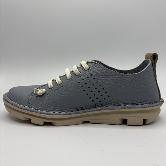 Left facing view of a blue sneaker with white laces