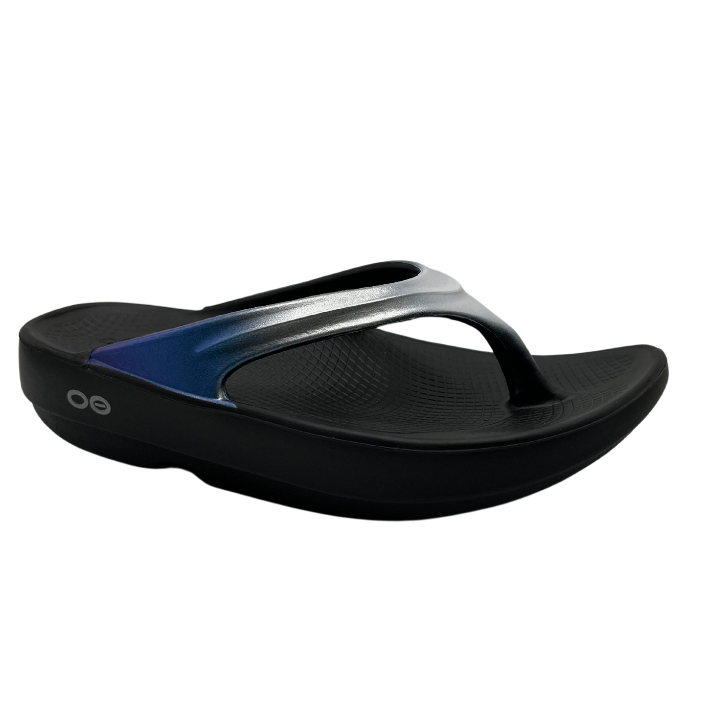 45 degree angled view of foam, thong strapped sandals with iridescent finish on straps