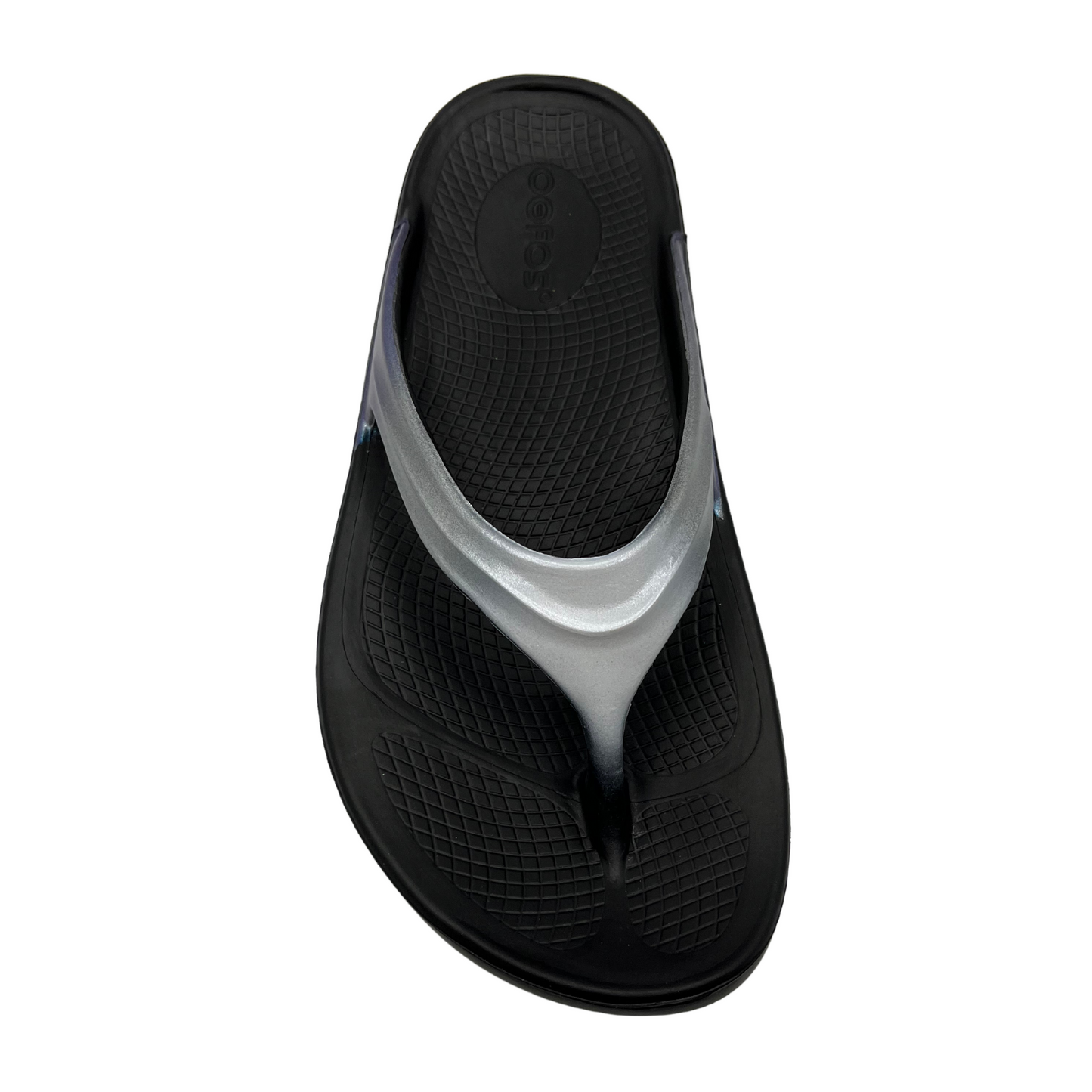 Top view of foam, thong strapped sandals with iridescent finish on straps