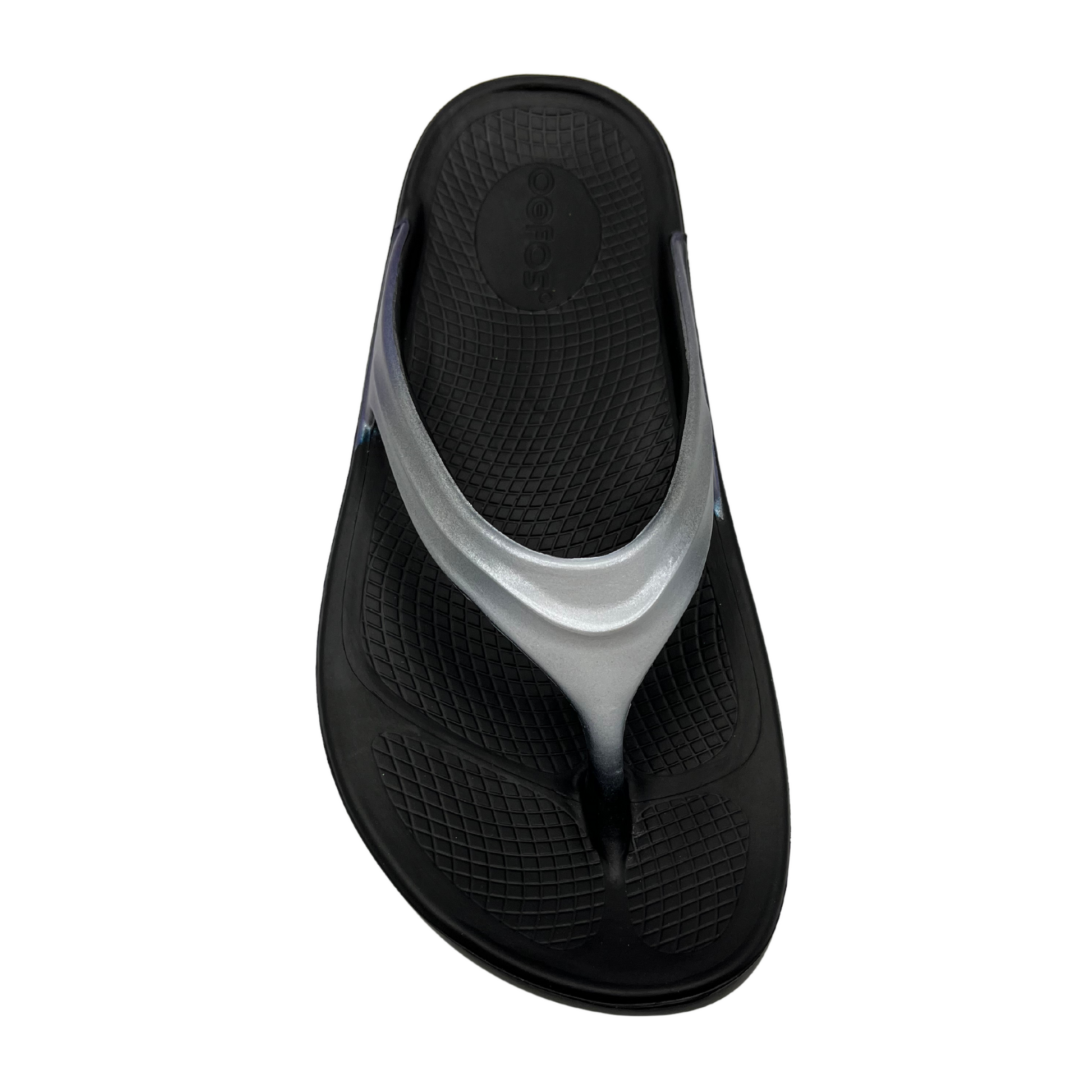 Top view of foam, thong strapped sandals with iridescent finish on straps