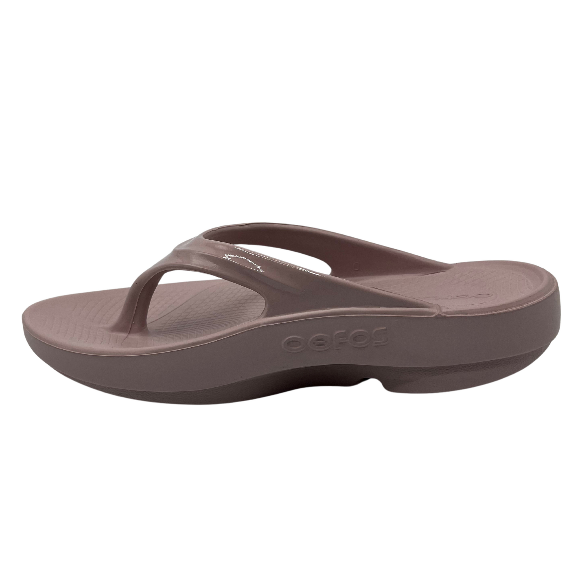 Left facing view of pink foam thong sandal