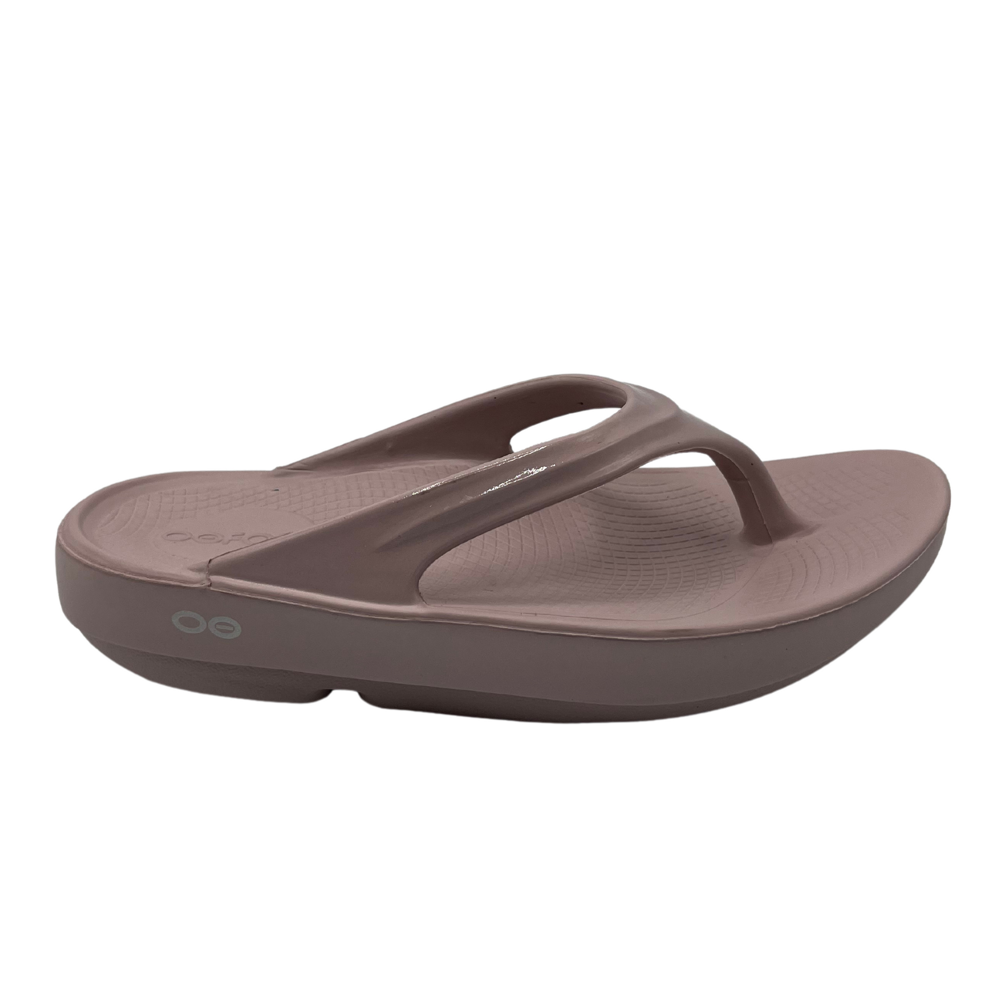 Right facing view of pink foam thong sandal