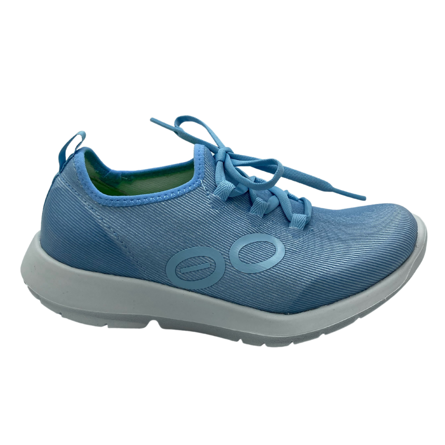 Right facing view of flexible blue sneaker with white sole.