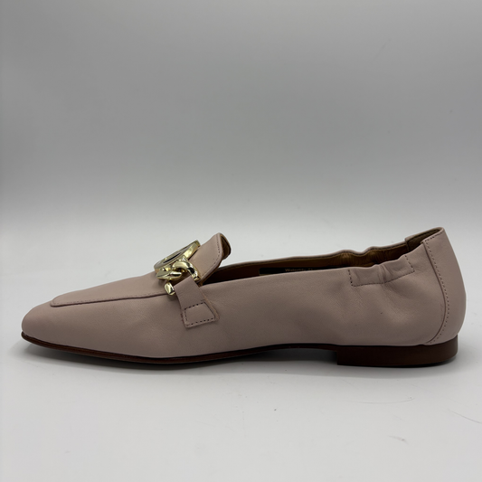 Left facing view of a leather loafer with a gold accent